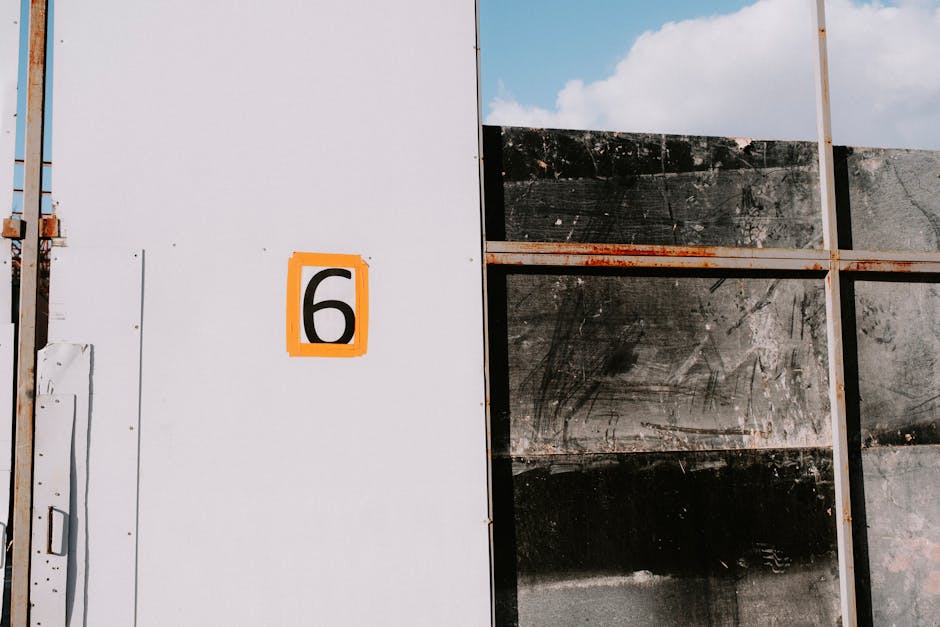 Modern minimalist number six on a clean white wall