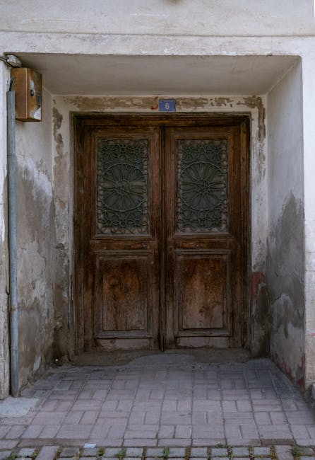 Heavy wooden double doors representing privacy and protection